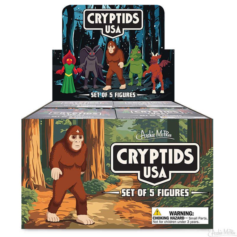 Box of Cryptids USA toy figures featuring mythical creatures in a forest setting.