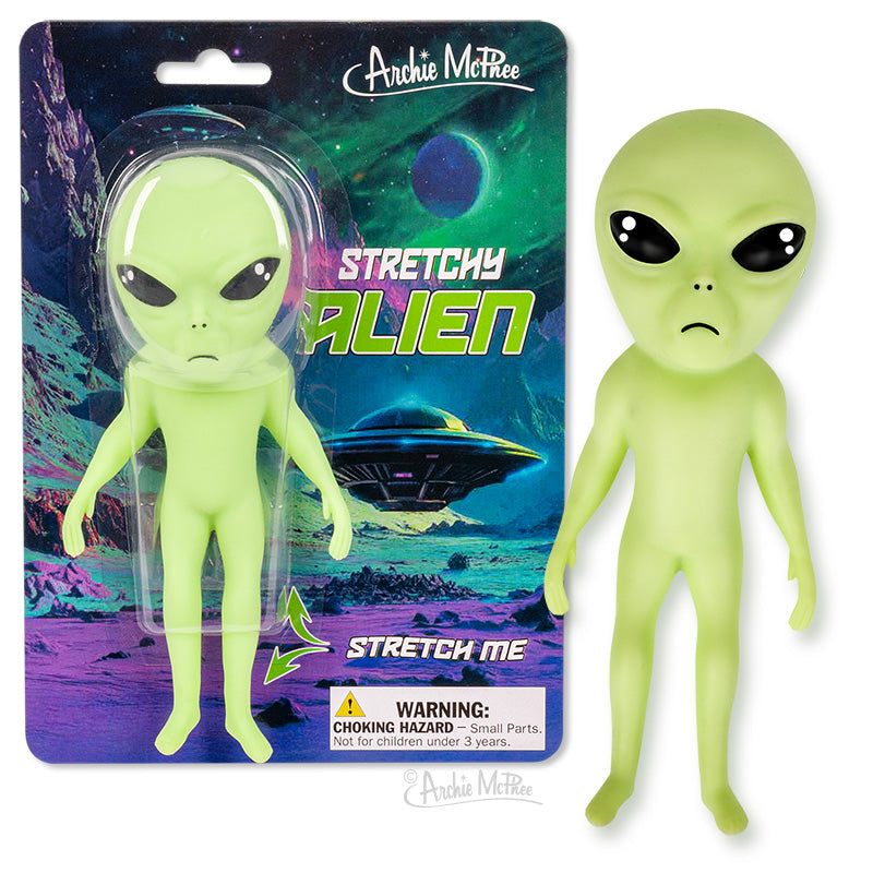 Two Stretchy Alien toys with big black eyes—one inside packaging and one outside—are set against a space-themed background.