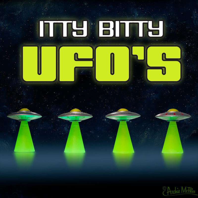Four small Itty Bitty UFO's with green bases glow against a starry outer space background; text reads "Itty Bitty UFO's.